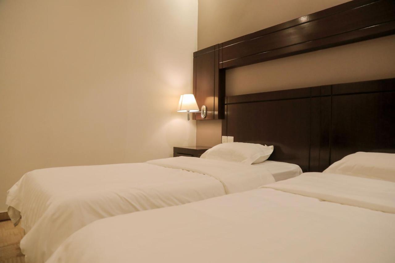 Sand Beach Suites Rayyis Bagian luar foto