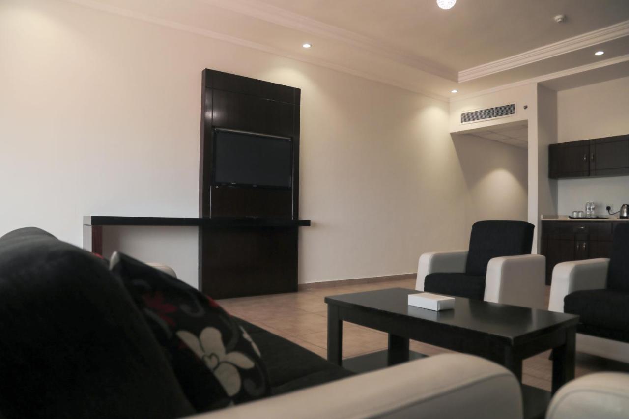 Sand Beach Suites Rayyis Bagian luar foto