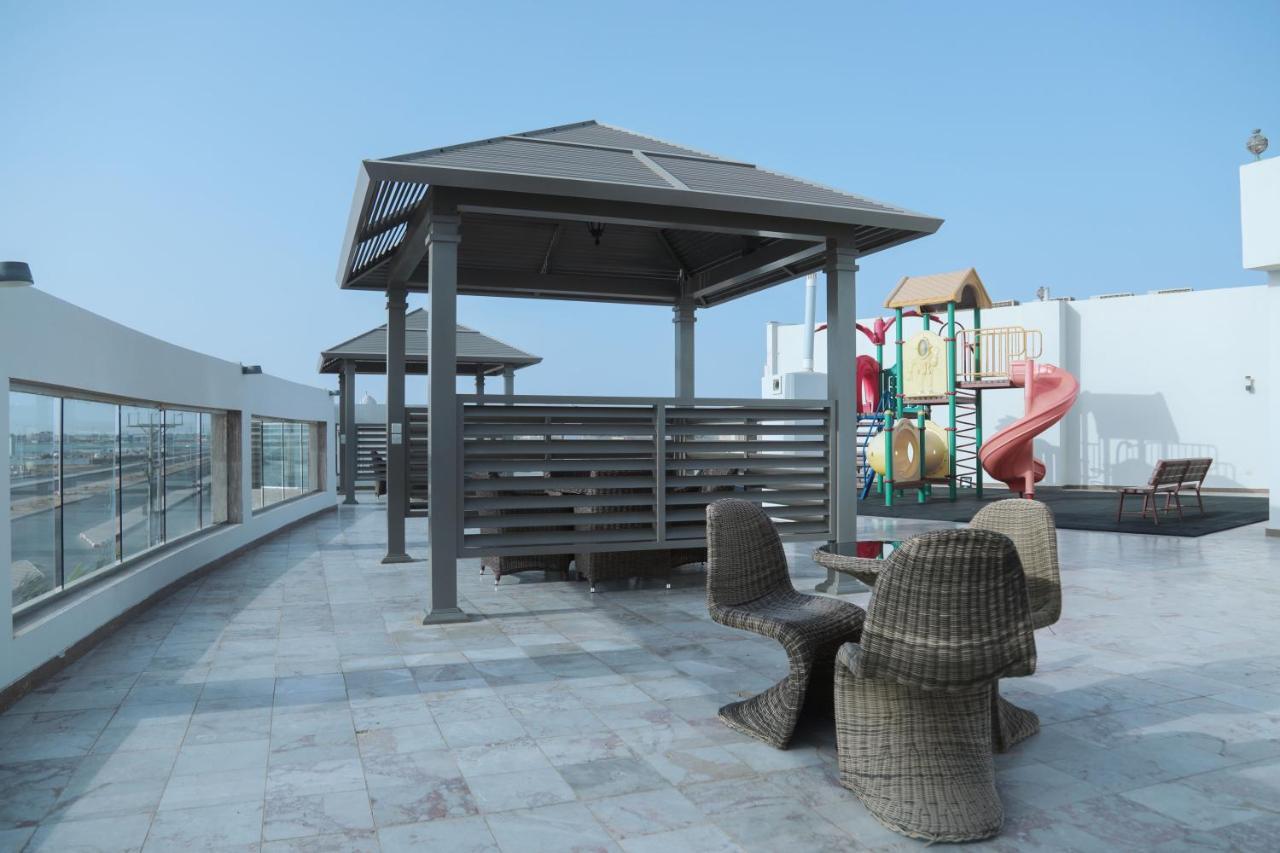 Sand Beach Suites Rayyis Bagian luar foto