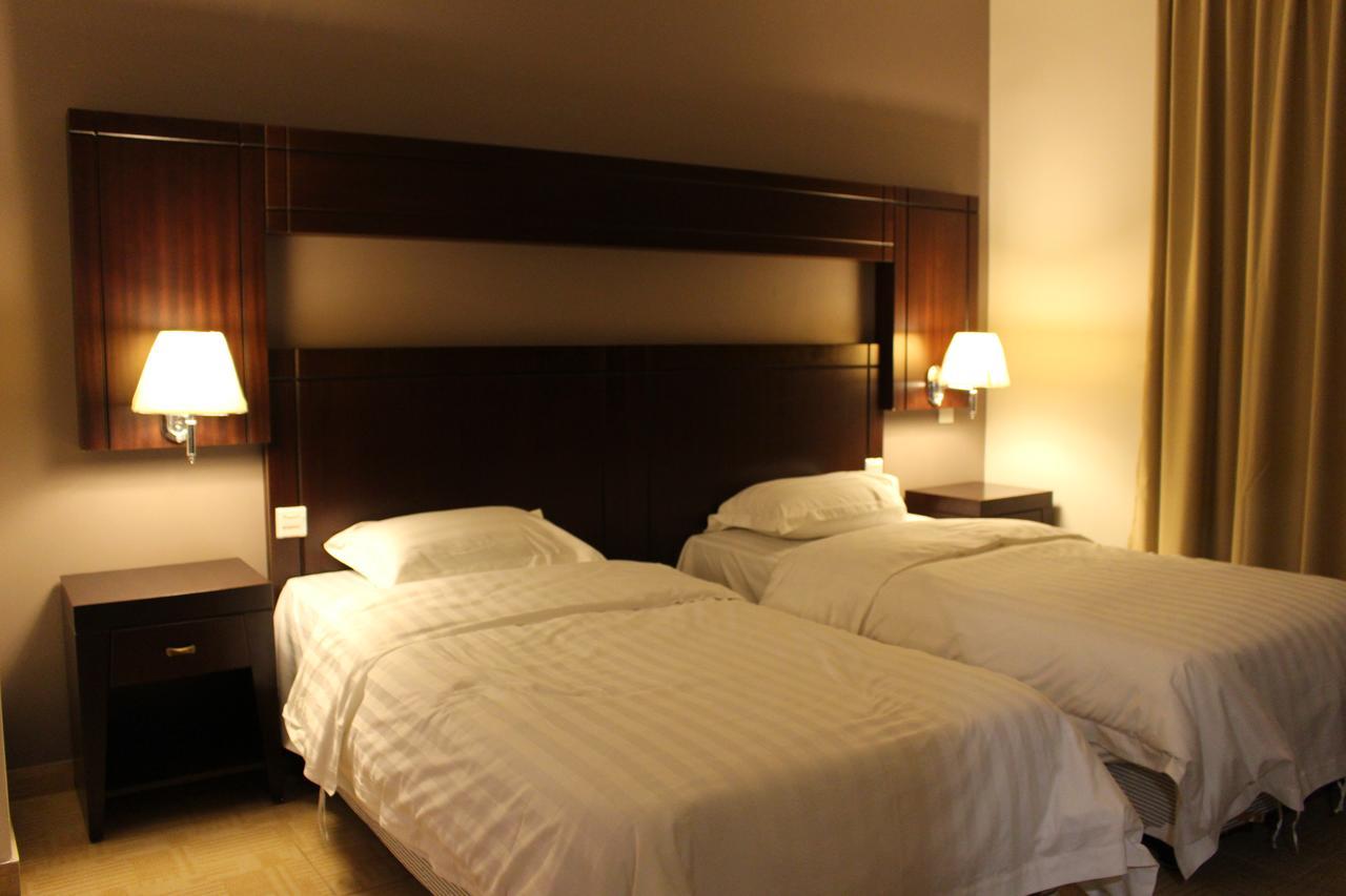 Sand Beach Suites Rayyis Bagian luar foto