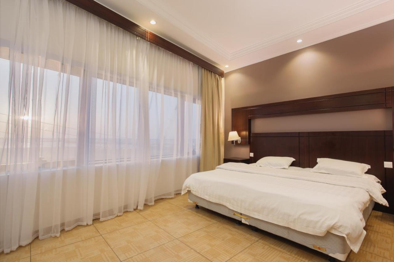 Sand Beach Suites Rayyis Bagian luar foto