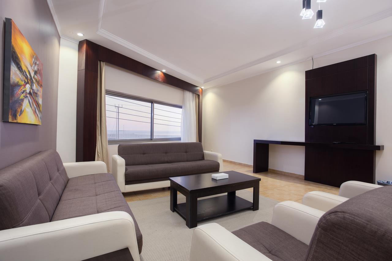Sand Beach Suites Rayyis Bagian luar foto
