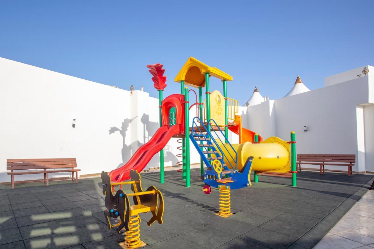 Sand Beach Suites Rayyis Bagian luar foto